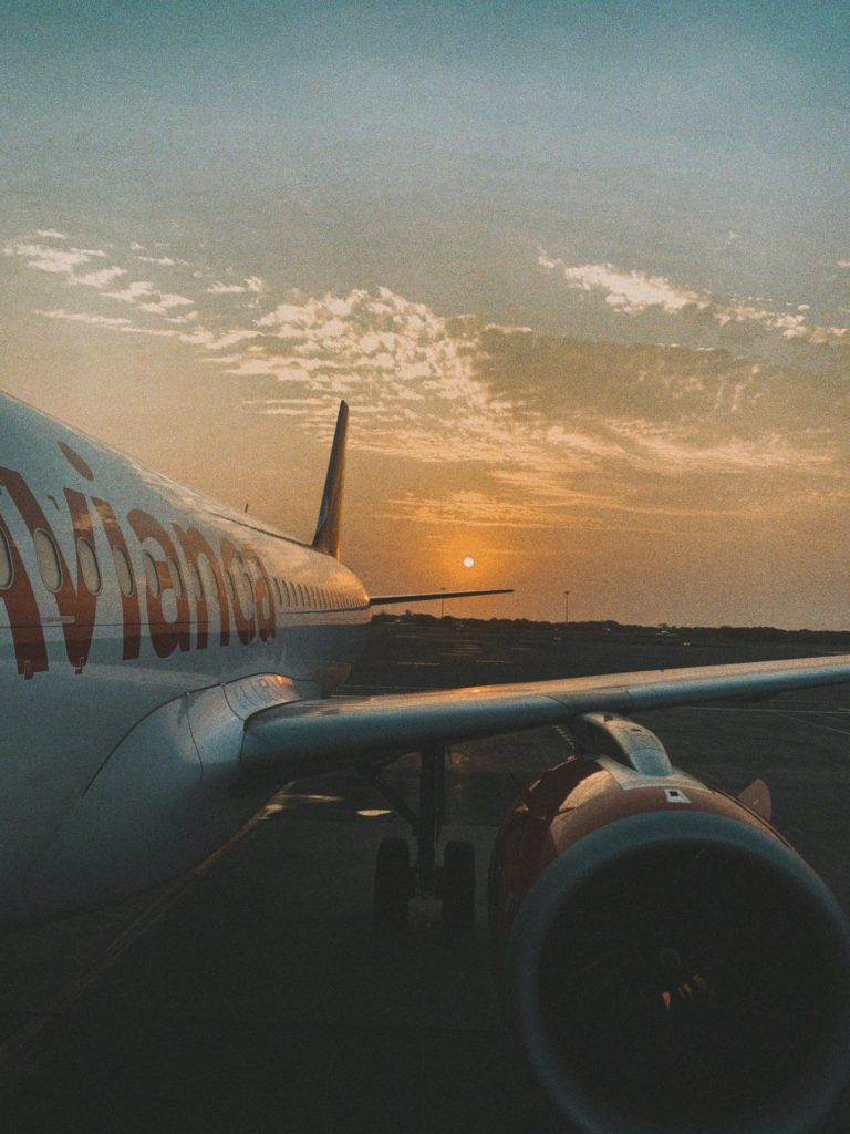 Airplane on Tarmac at Sunset