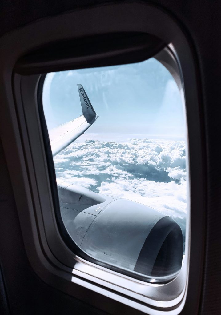 a view of the wing of an airplane through a window